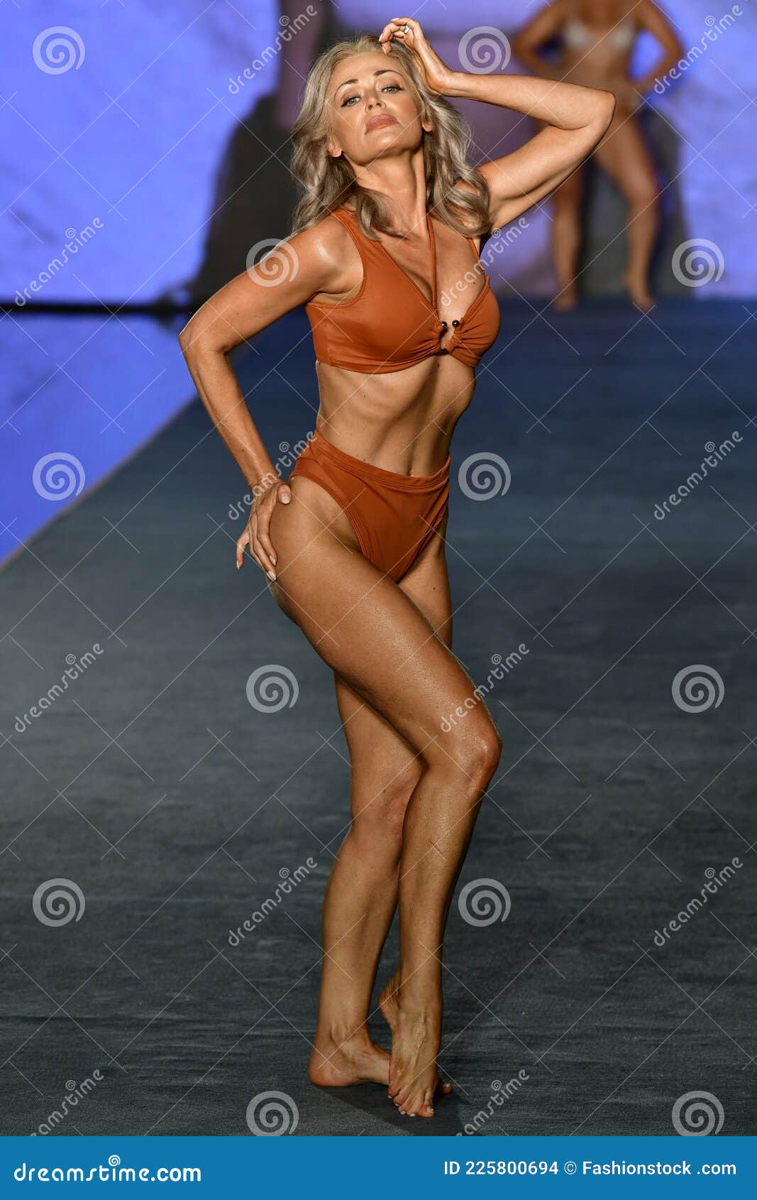 Kathy Jacobs Walks the Runway during the 2021 Sports Illustrated