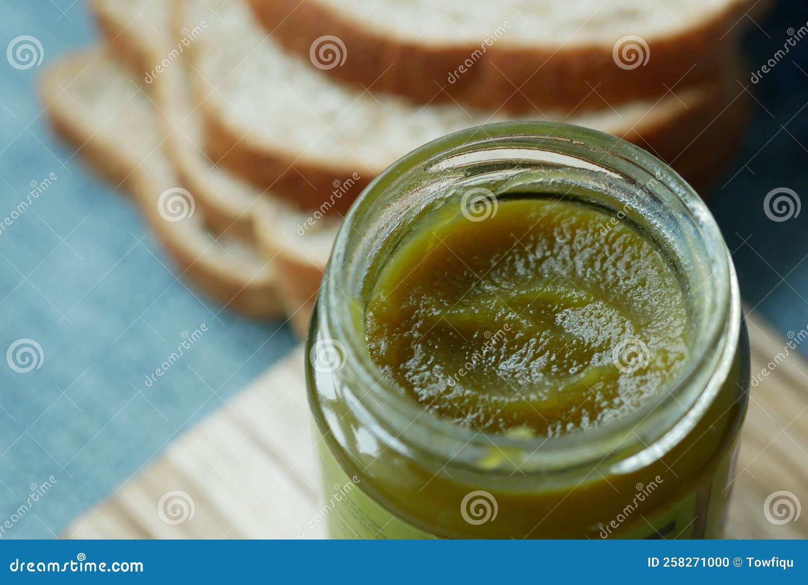 Kaya Spread in a Container and Bread on Table , Stock Photo Image of