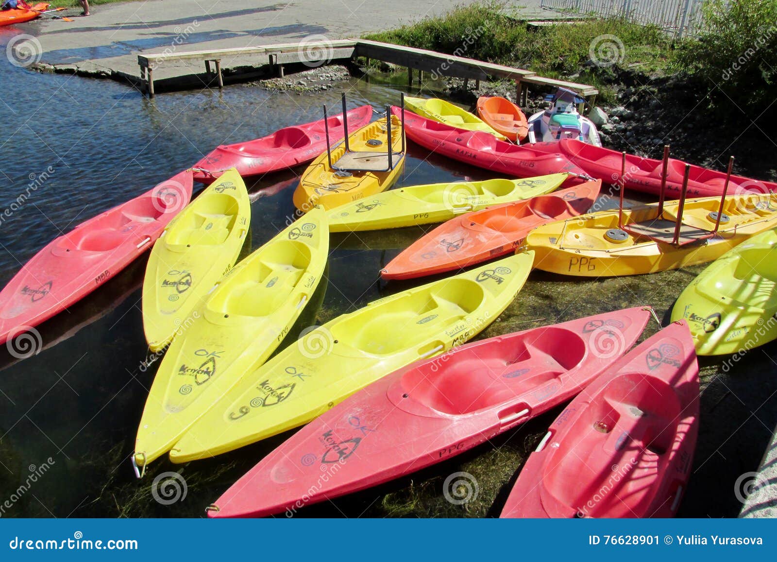 Colorful Kayaks On A Lake Shore Editorial Image 