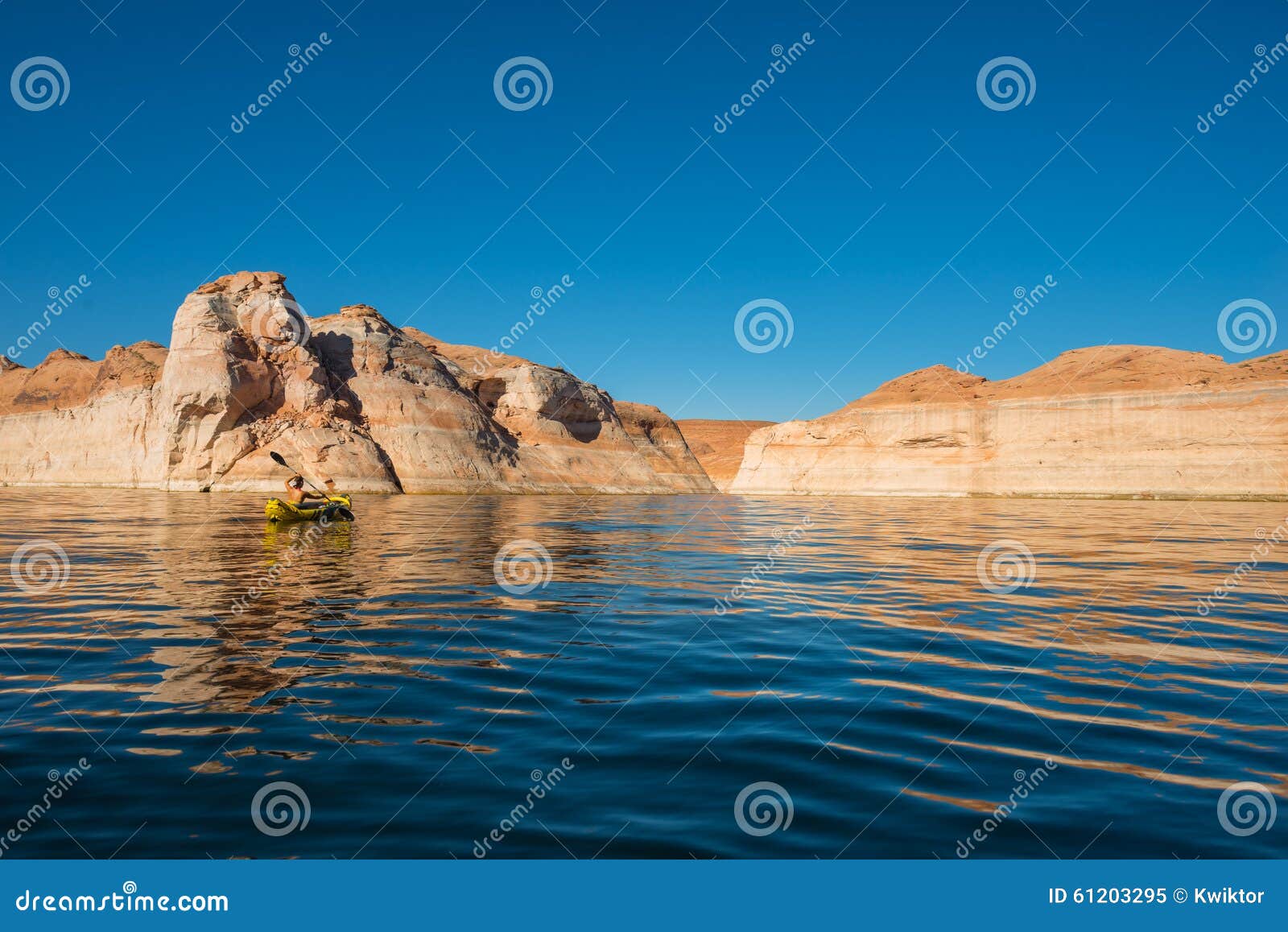 kayaker paddling the calm waters of lake powell utah