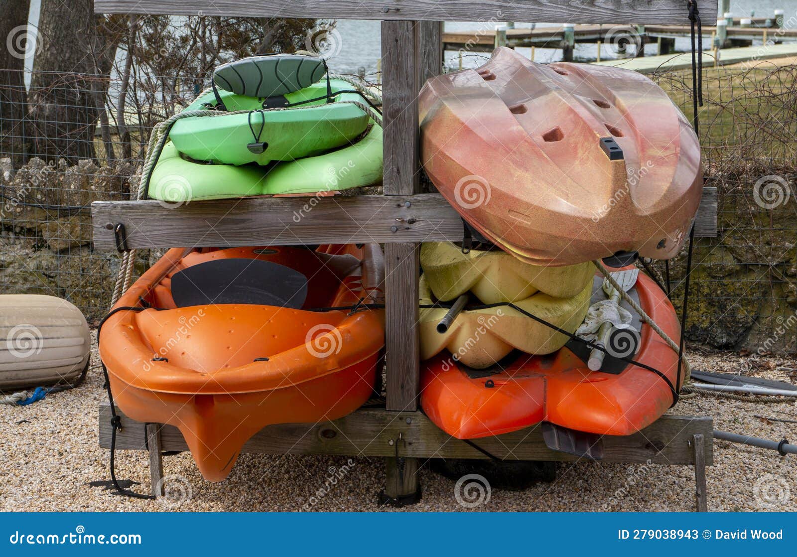 kayaks stacked and sored at a beach