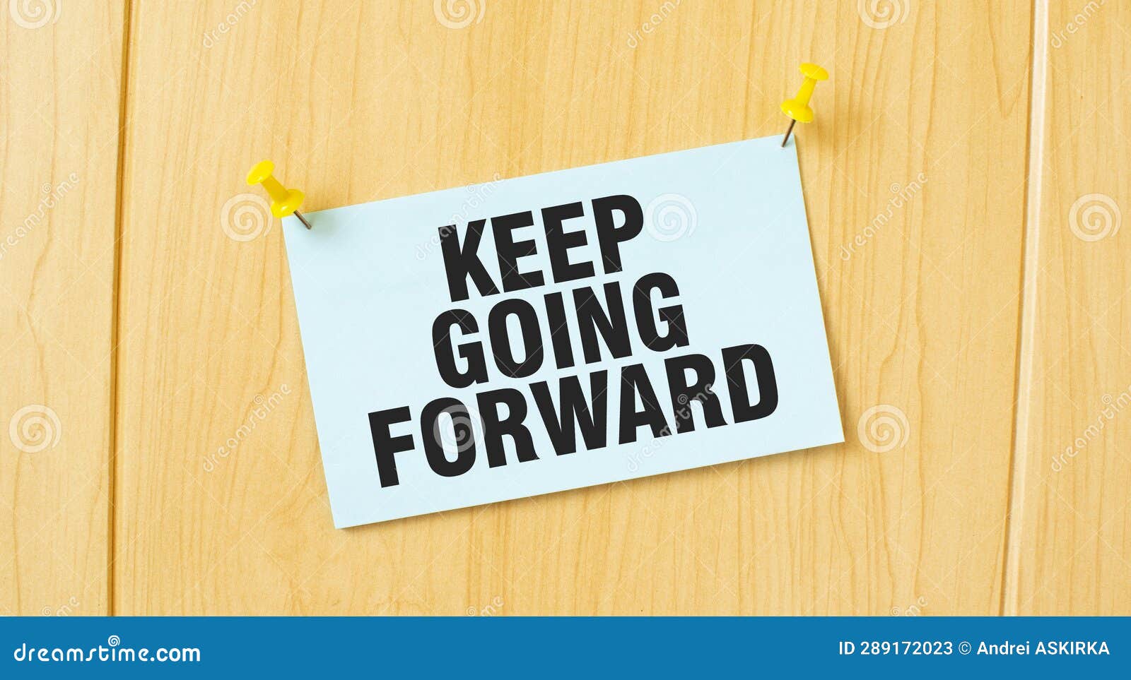 KEEP GOING FORWARD Sign Written on Sticky Note Pinned on Wooden Wall