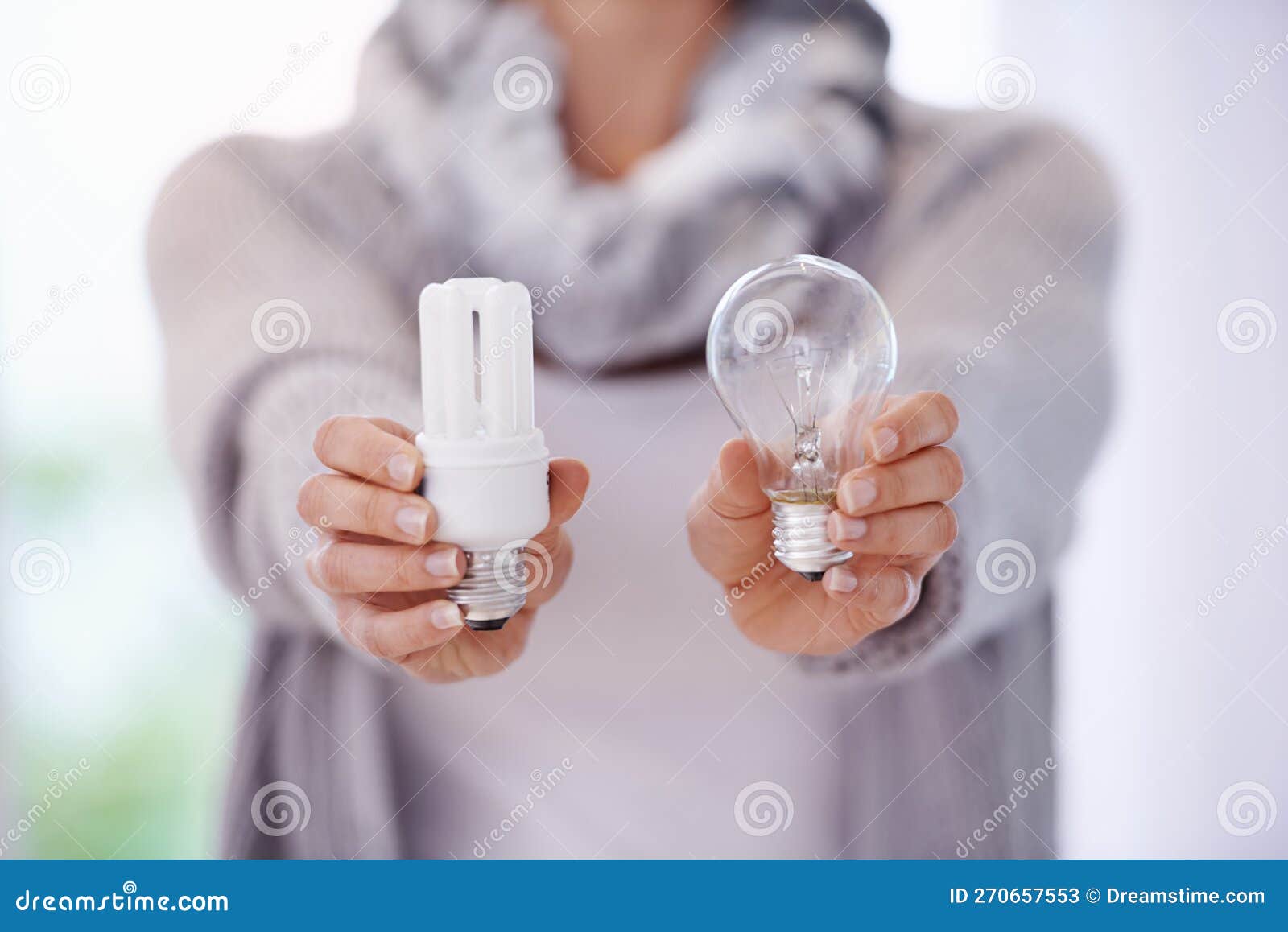 Keep the Lights Burning Longer. a Cropped Image of a Woman Holding Two
