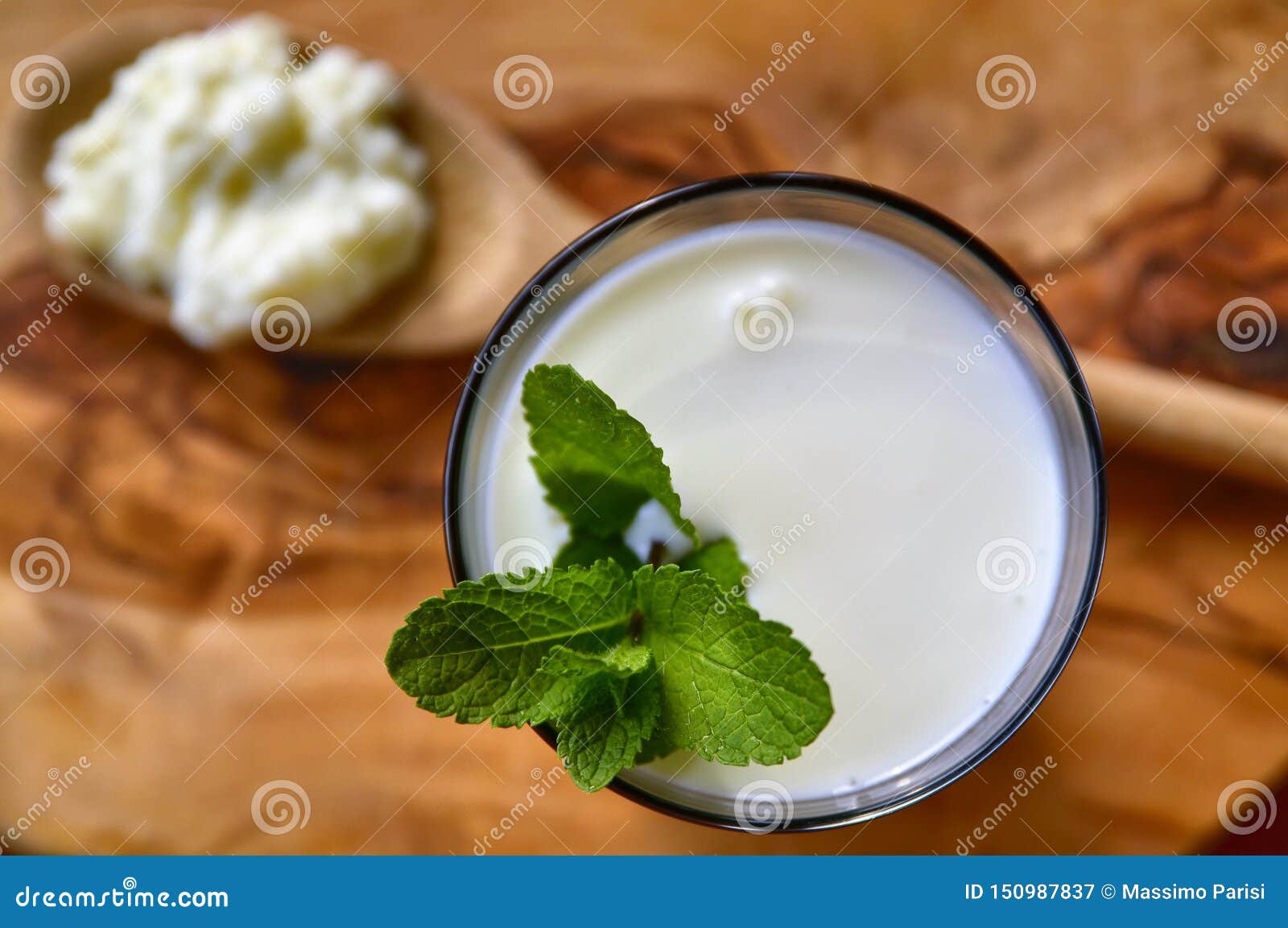 close-up shot on a full glass of white kefir