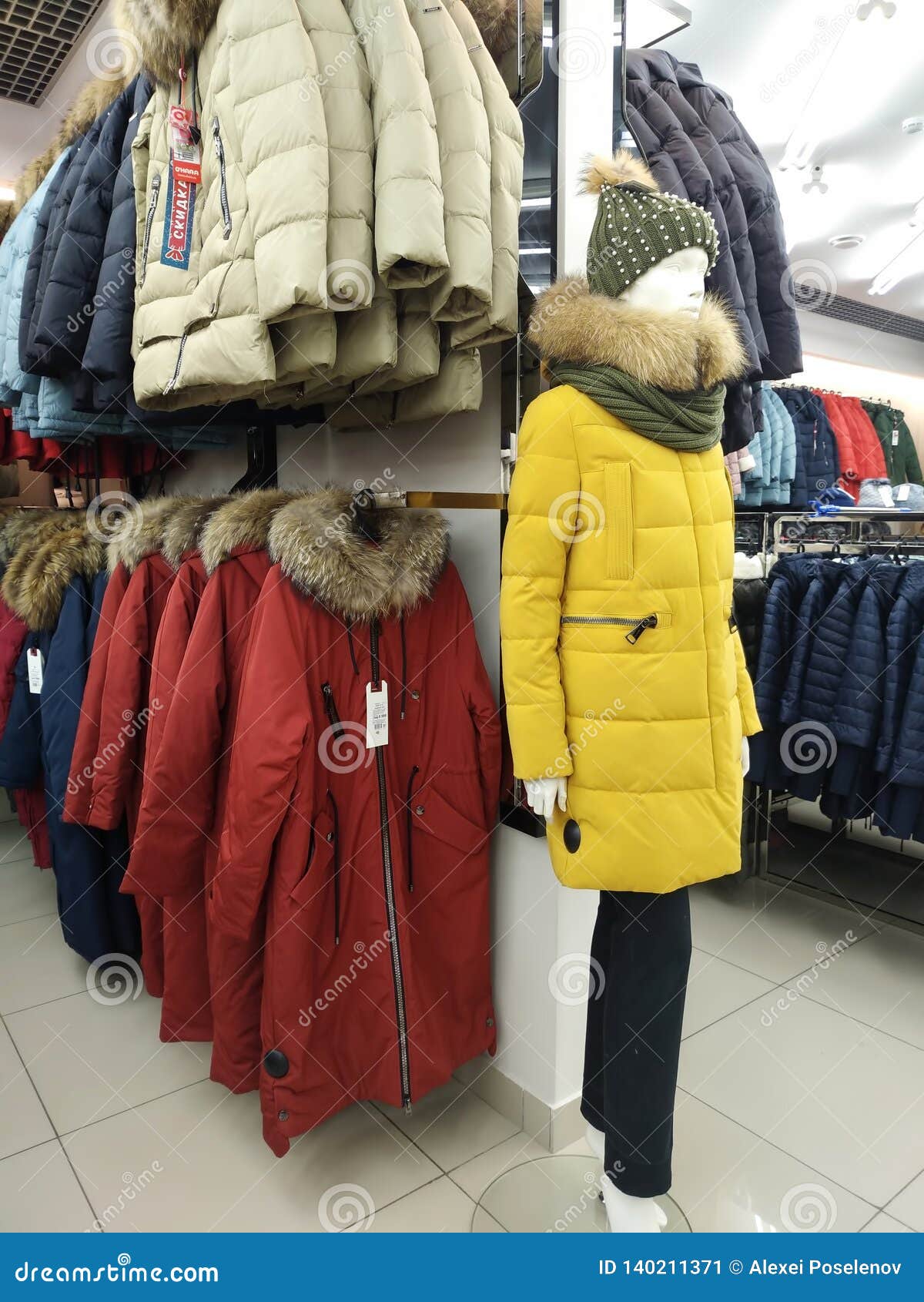 Sale of Warm Female Winter Coats and a Mannequin Dressed in Winter ...