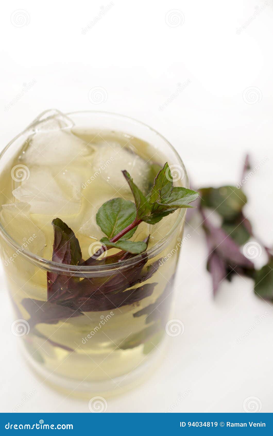 Kentucky derby drink in a glass goblet on a light background. Mint Drink Kentucky derby in a glass goblet on a light background.