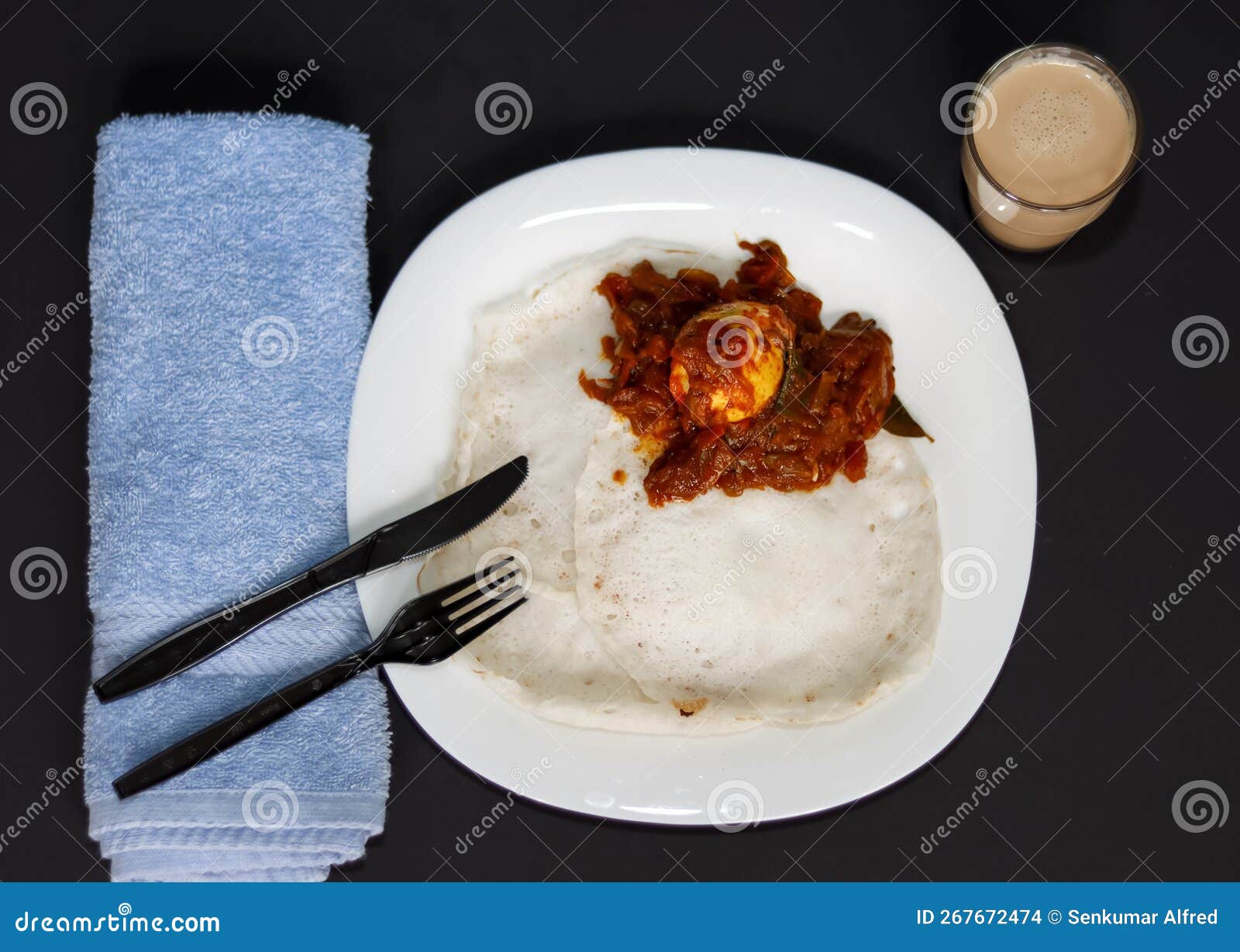 Kerala Tasty Special Breakfast Appam and Egg Roast with Tea Stock Photo