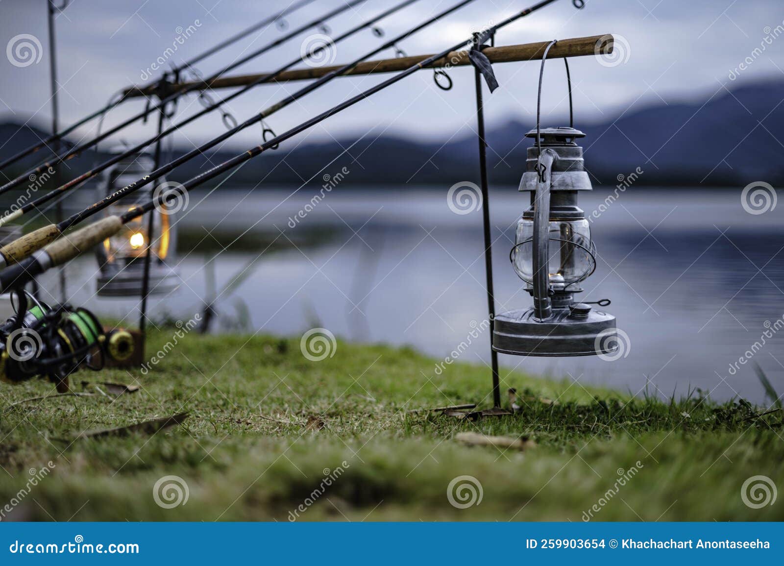https://thumbs.dreamstime.com/z/kerosene-lamps-lit-next-to-fishing-rods-to-light-up-night-khao-chuk-dam-kerosene-lamps-lit-next-to-fishing-rods-to-259903654.jpg