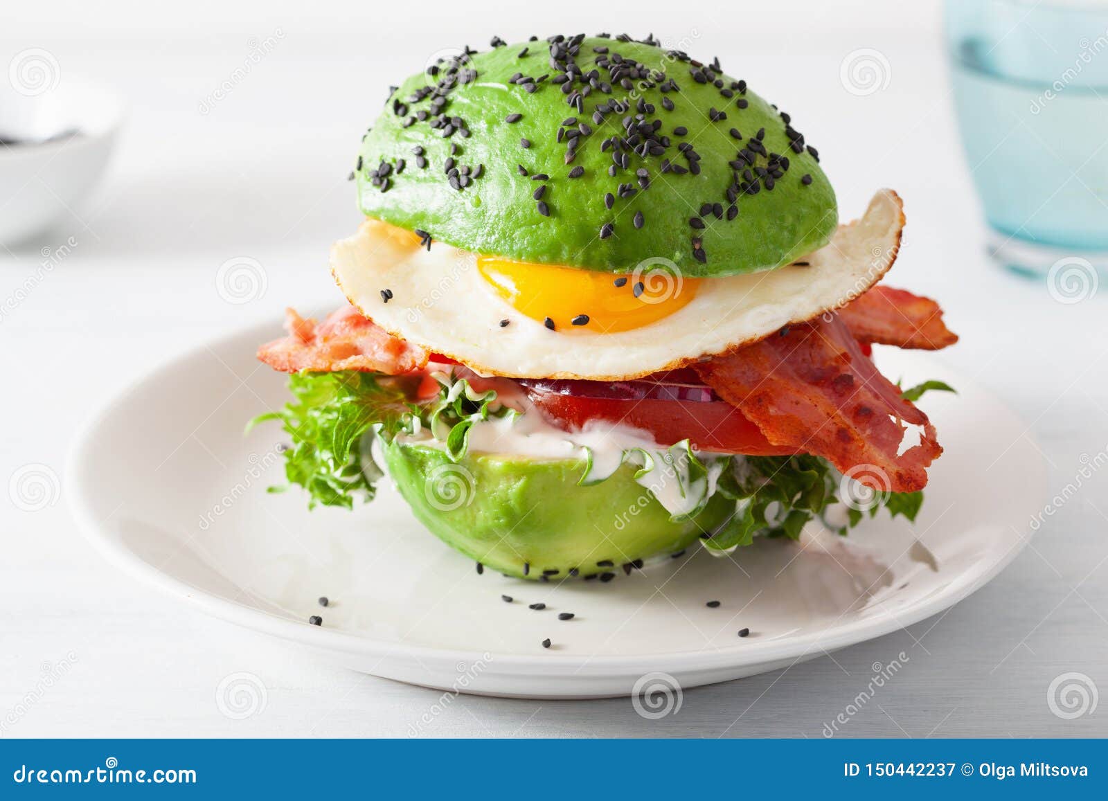 Keto Paleo Diet Avocado Breakfast Burger with Bacon, Egg, Tomato Stock