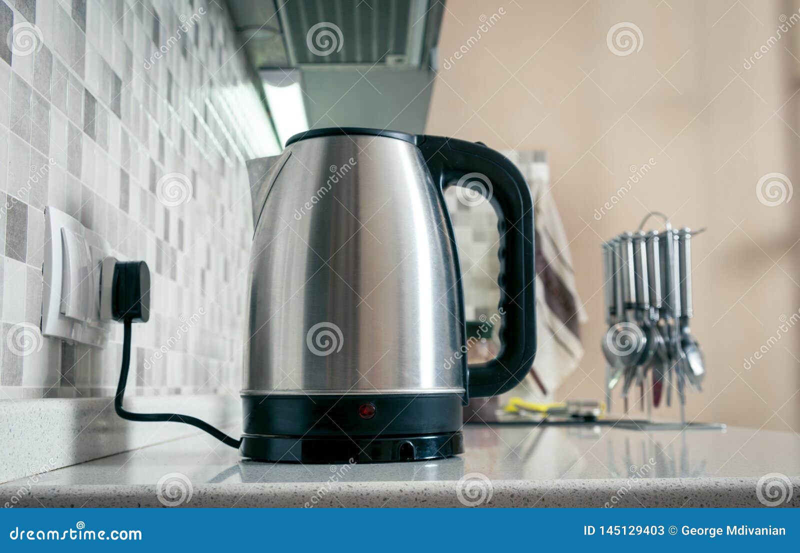 Kettle closeup in kitchen stock image. Image of beverage 145129403