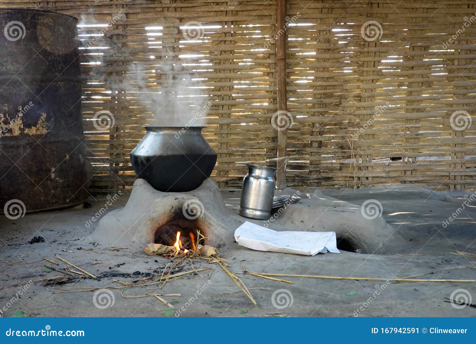 Cooking on a Mud Oven stock image. Image of asian, fire 167942591