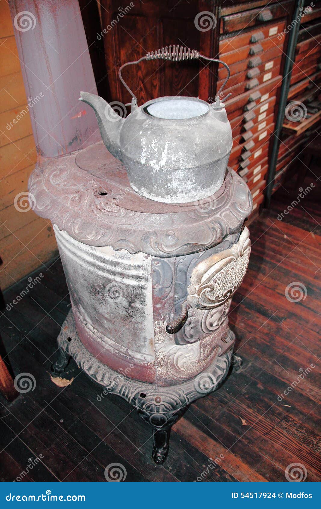 Kettle and Pot Belly Stove stock photo. Image of retro 54517924