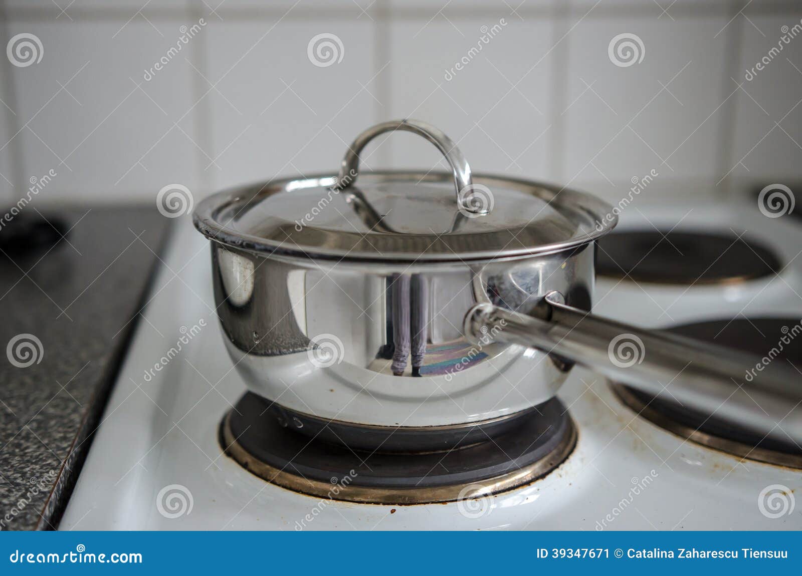 Kettle on stove stock image. Image of kitchenwear, metallic 39347671
