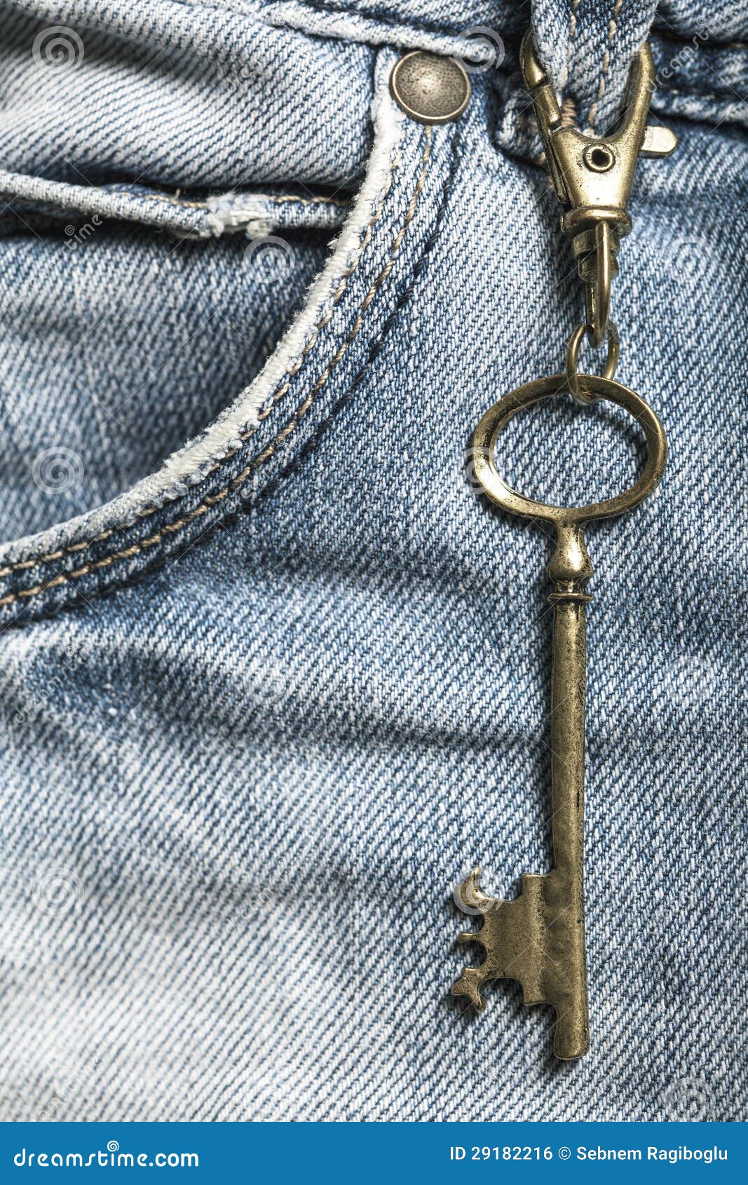 The key on a blue jeans stock photo. Image of metallic 29182216