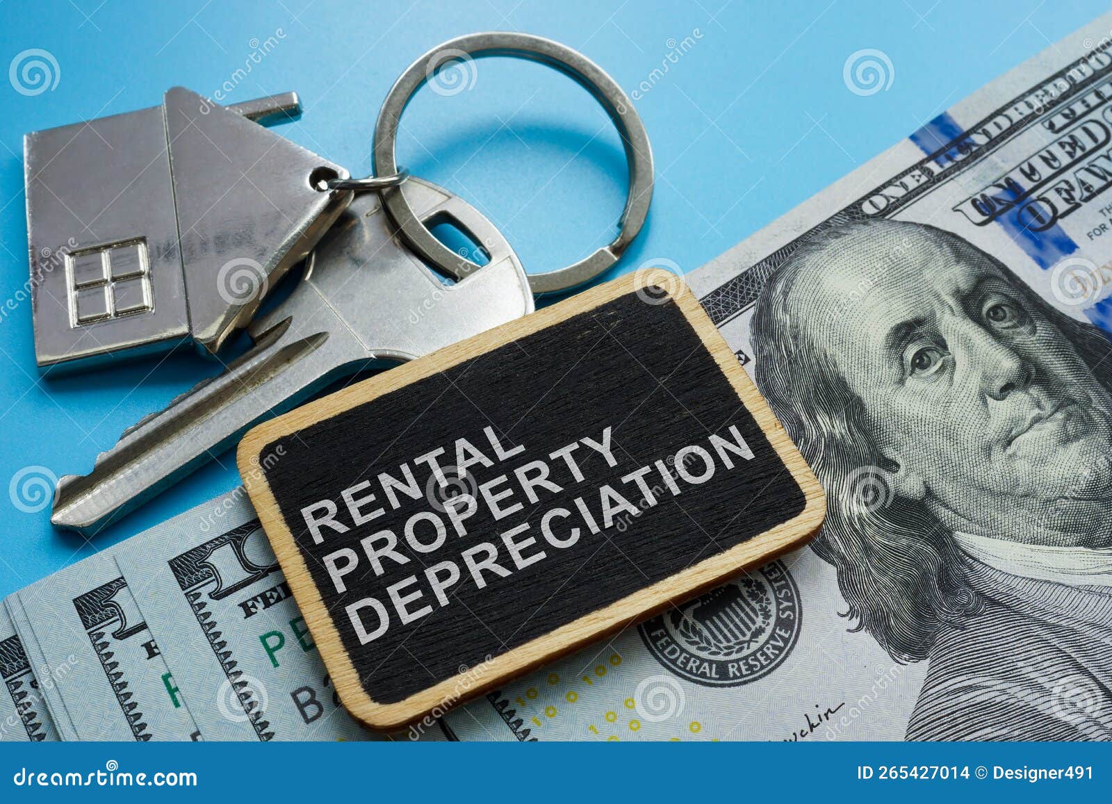 key, cash and plate with sign rental property depreciation.