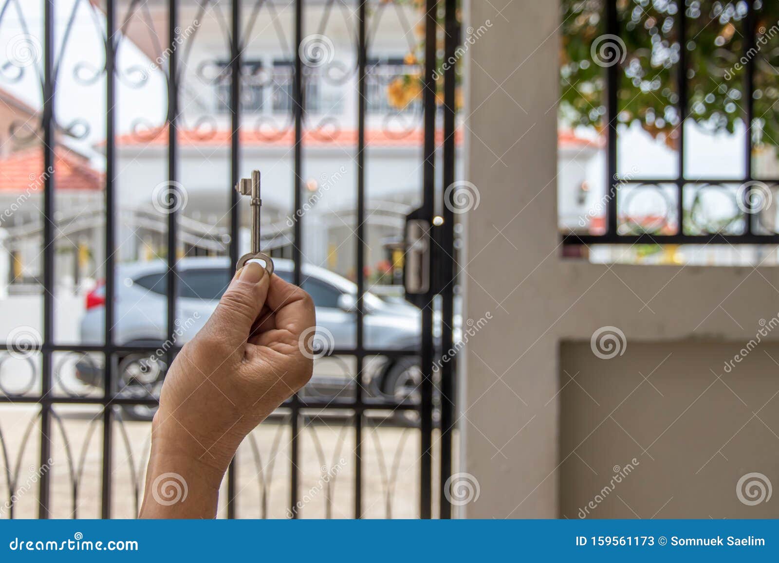 Key On Hand Of People Open The Door To Inside Outside Door