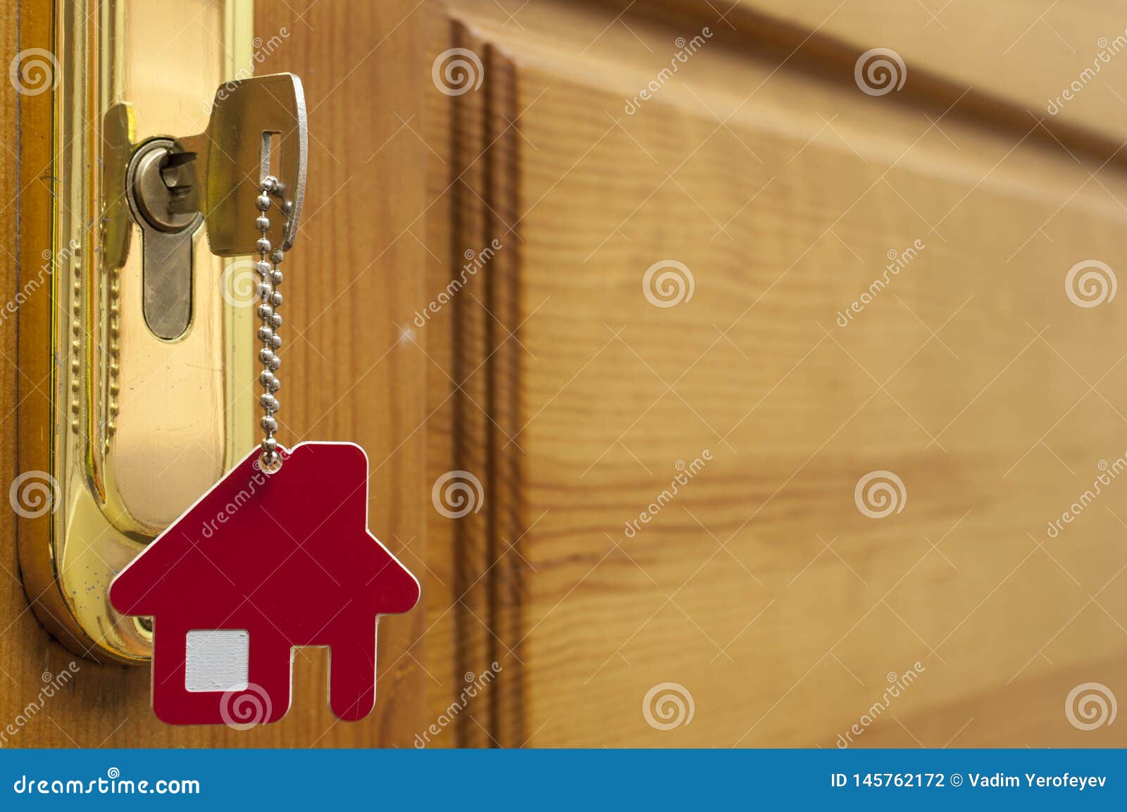 A Key in a Lock with House Icon on it Stock Photo Image of loan