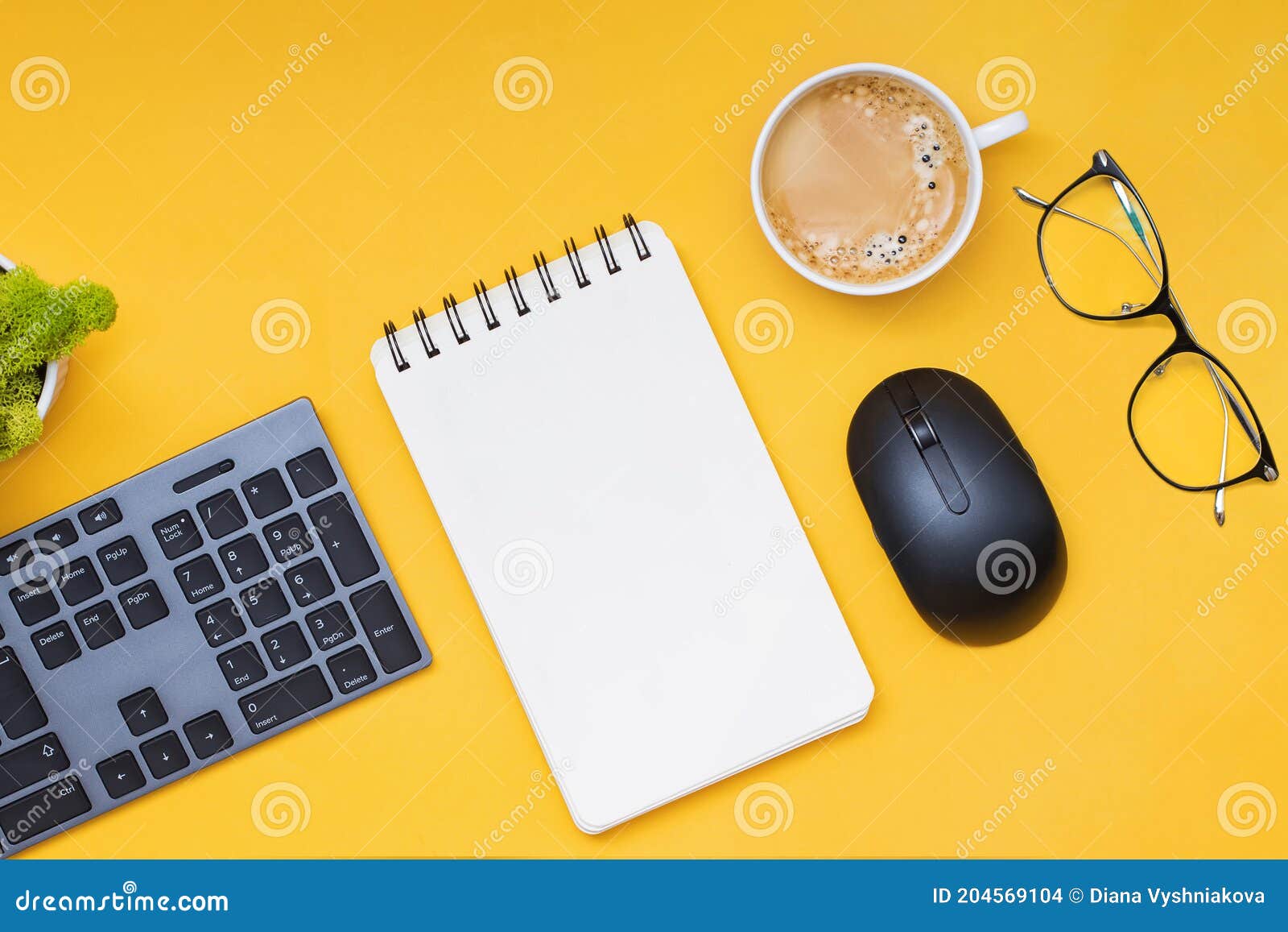 keyboard, computer mouse and cofffe on yellow background
