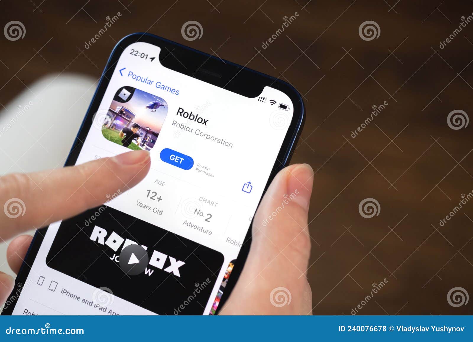 Roblox Logo and App on a Mobile Screen in a Hand Editorial Stock