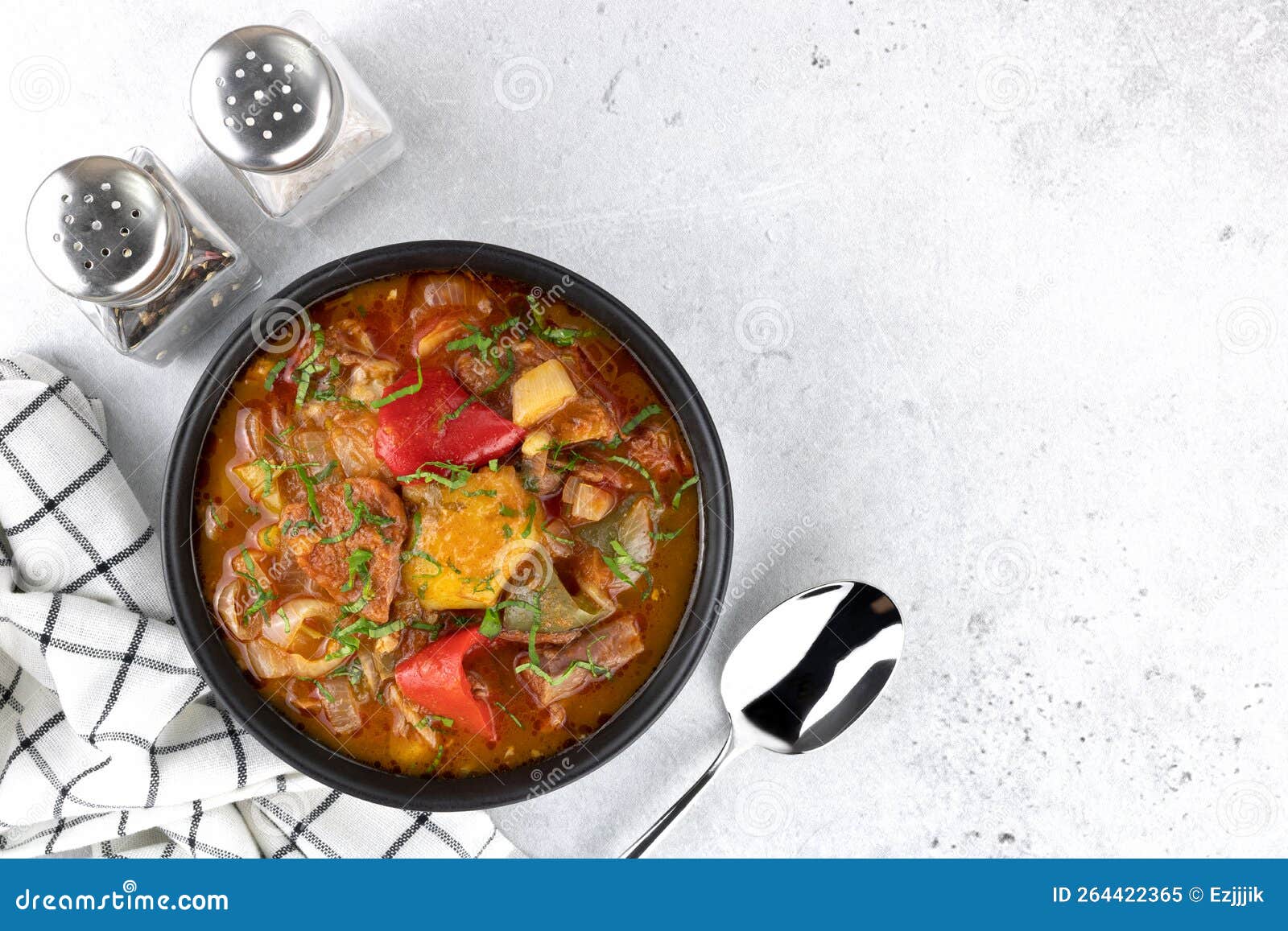 khashlama - meat stew of beef or lamb meat with vegetables, spices on a gray background. armenian and georgian cuisine.