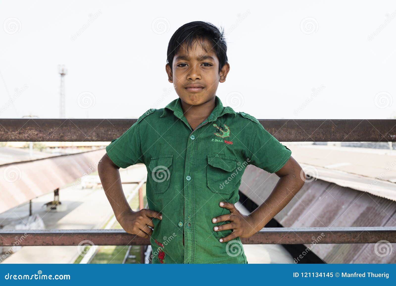 A Boy Poses for a Photo while Herding Cattle Outside of Bhadarsa