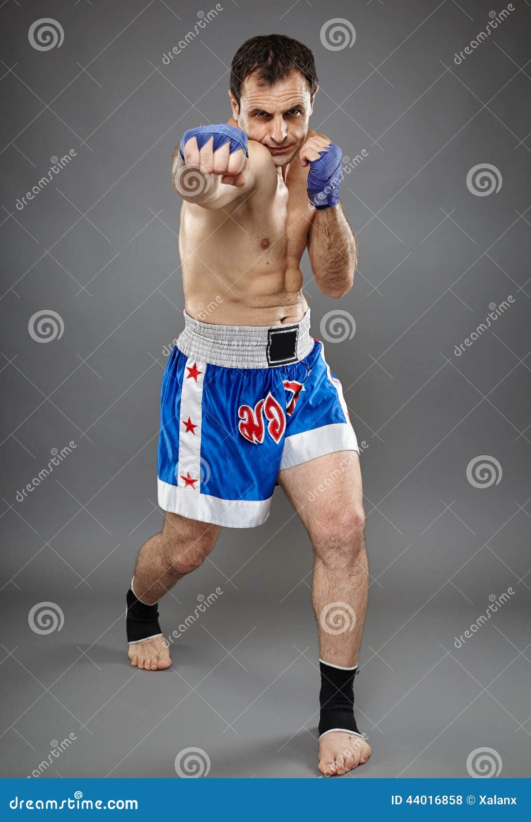 Kickbox Fighter Executing a Punch Stock Photo Image of karate, health