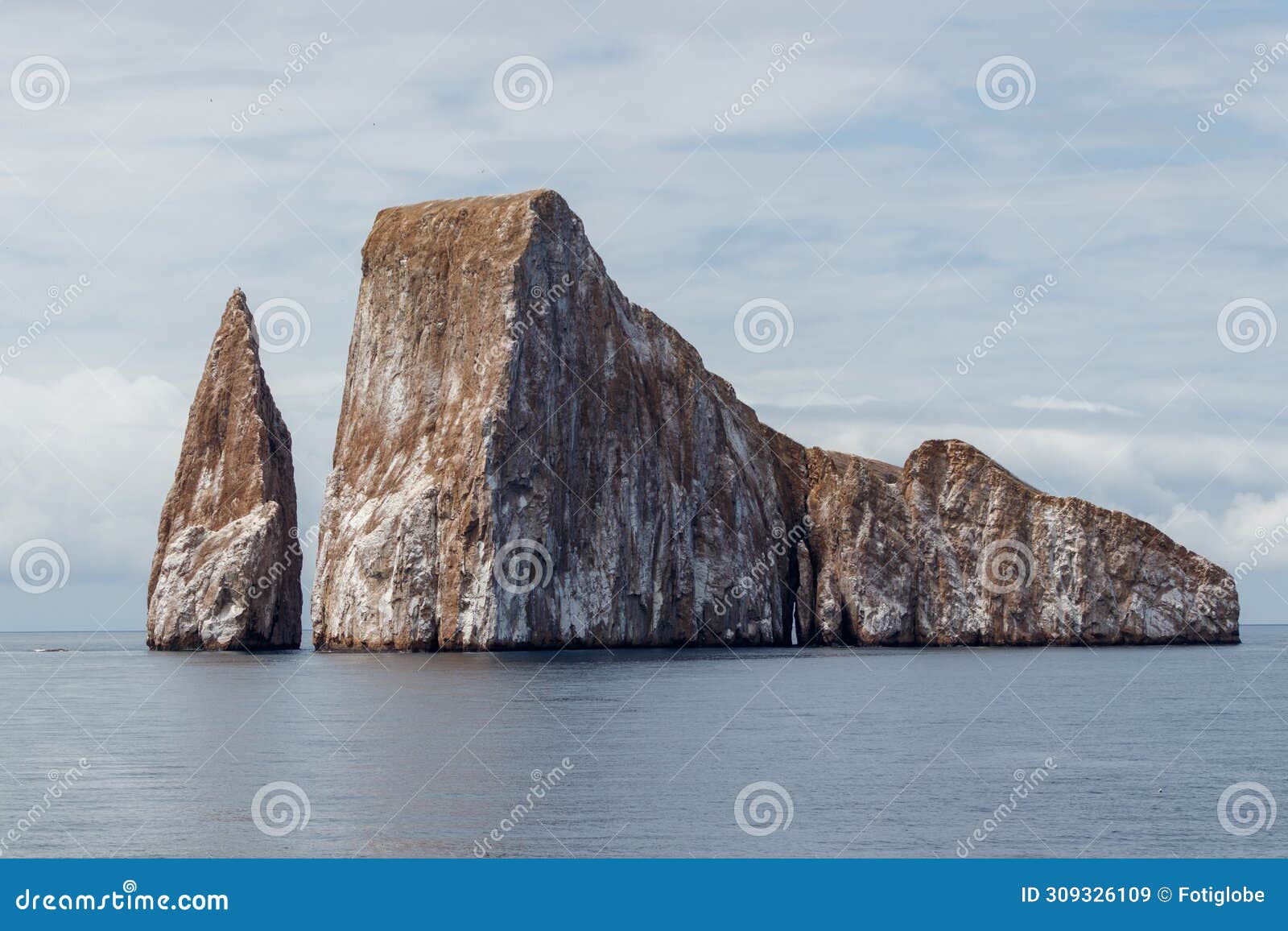 kicker rock or roca leon dormido sticking out of the ocean, san cristobal, galapagos