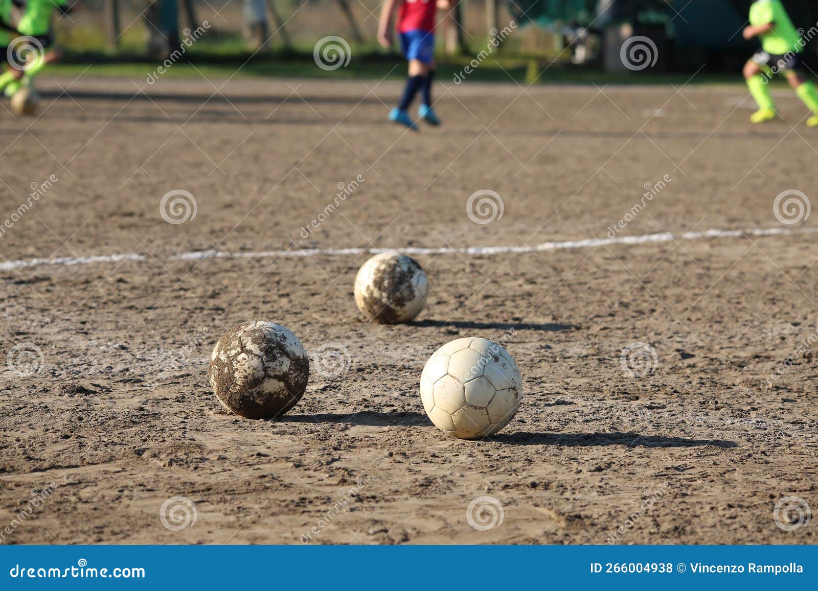 Kicking a Ball on a Clay Field Stock Photo Image of playing, footwear