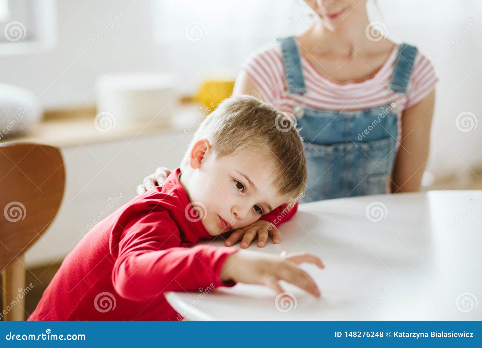 kid with adhd don`t paying attention to his mother