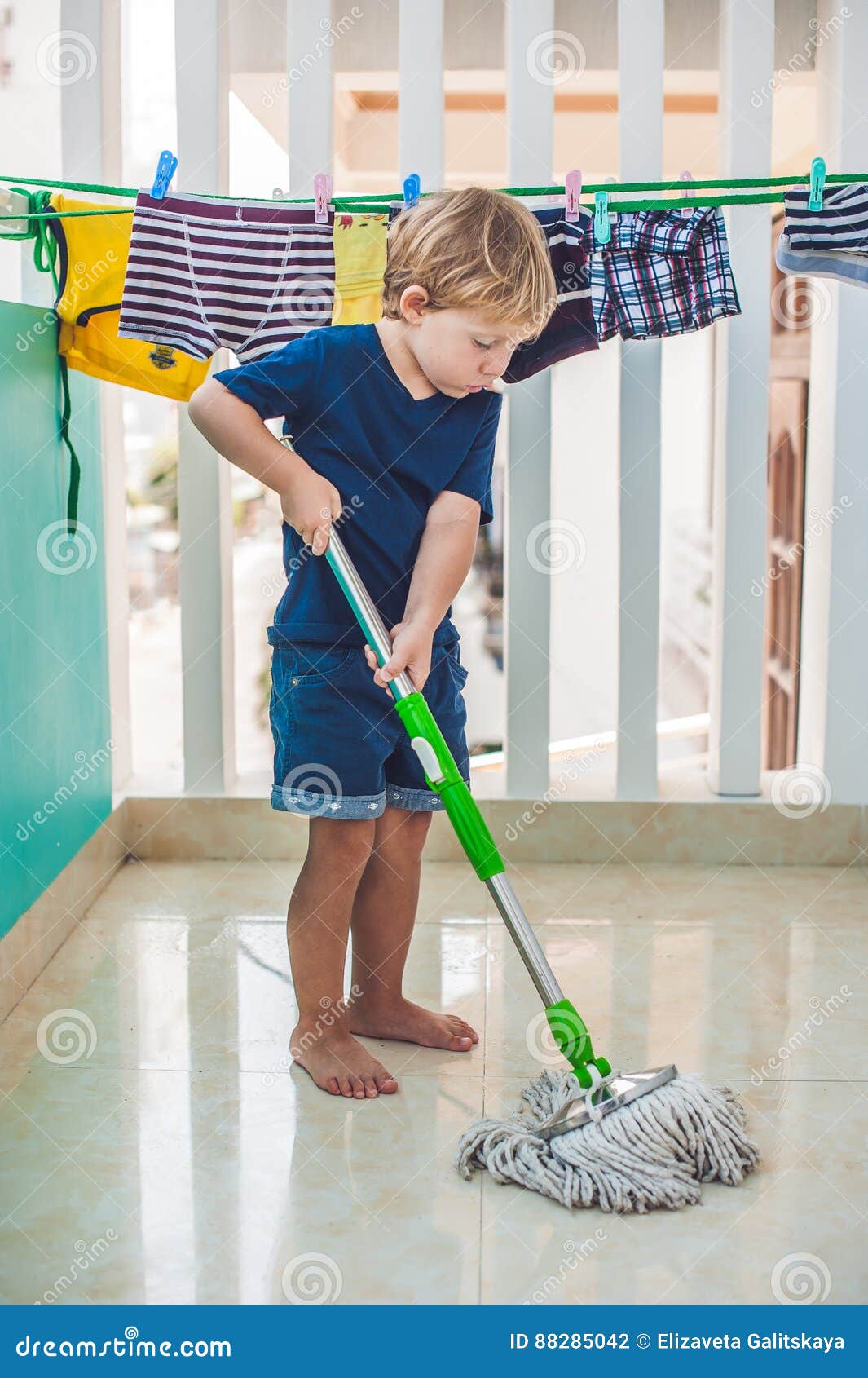 Kid Boy Cleaning Room Washing Floor With Mop Little Home Helper Stock