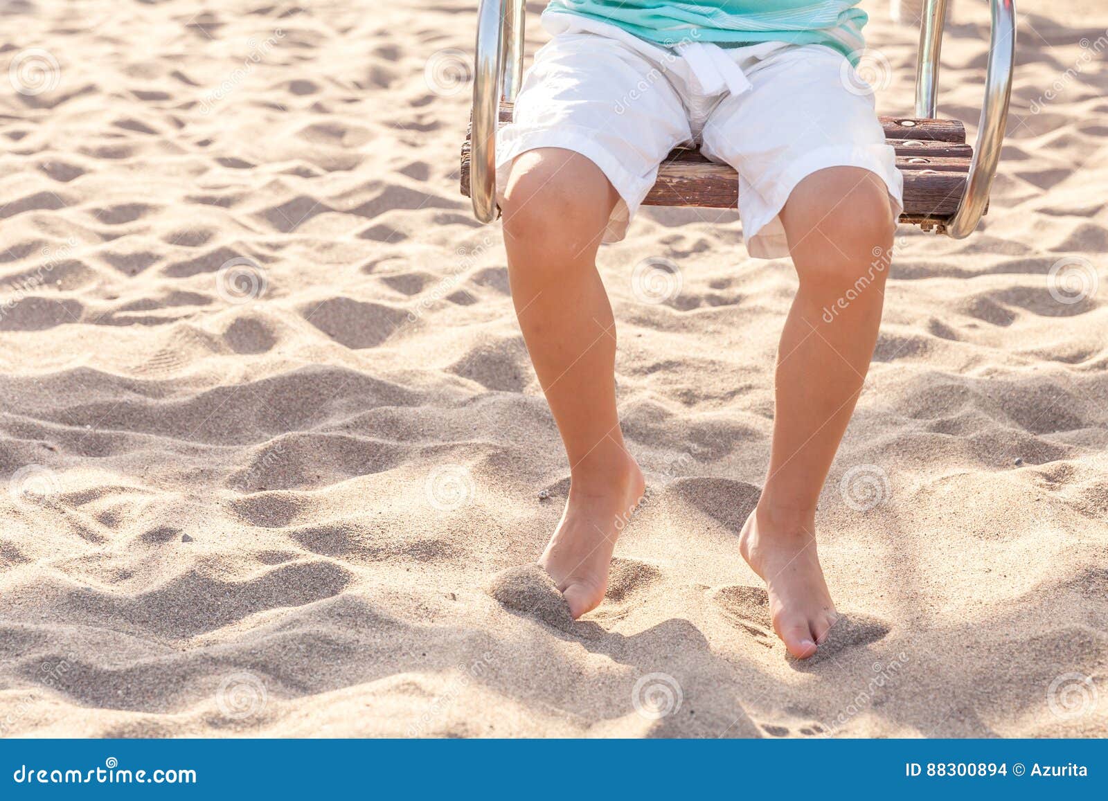 Kid boy legs on a swing stock photo. Image of childhood 88300894