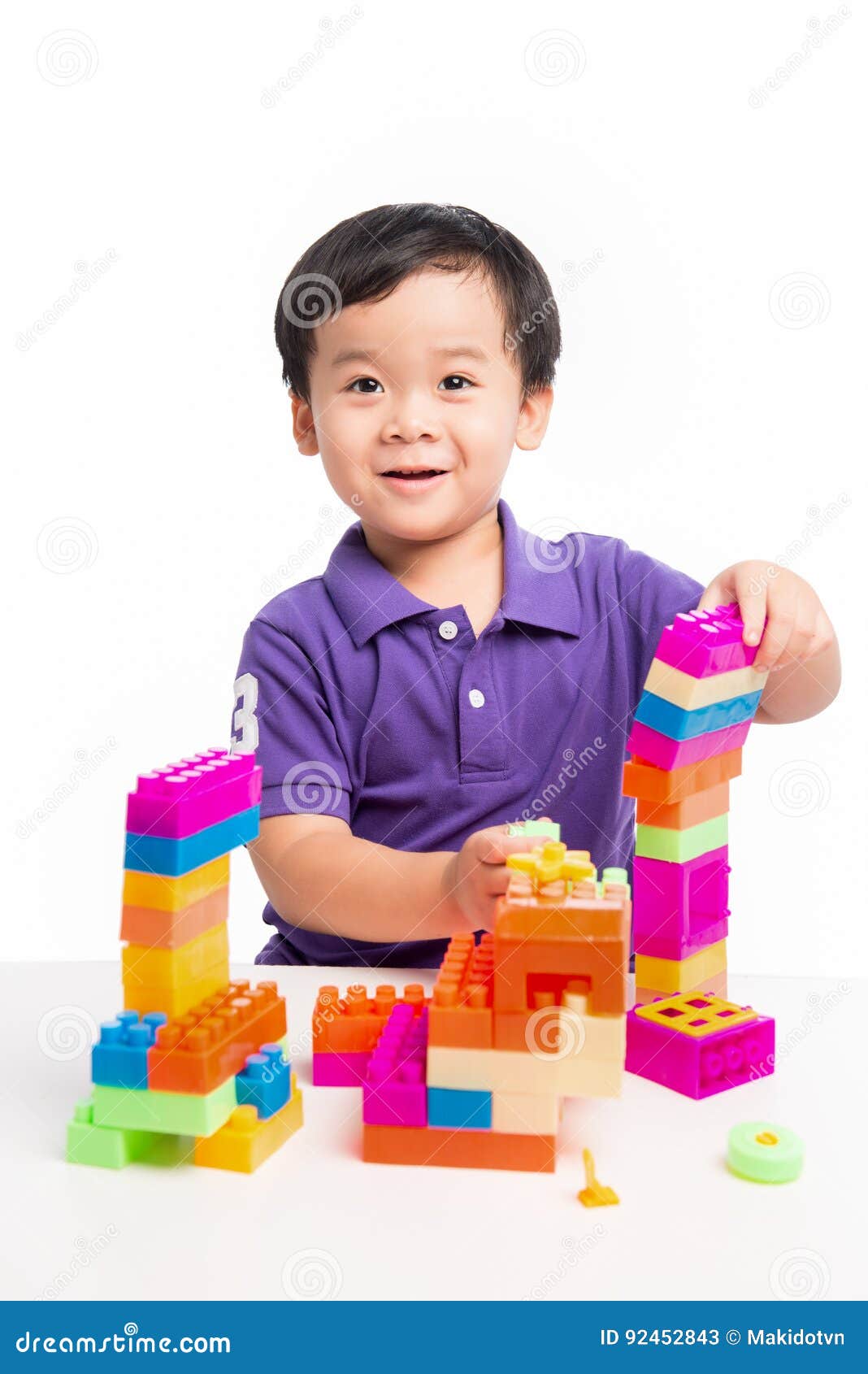 boy playing with blocks