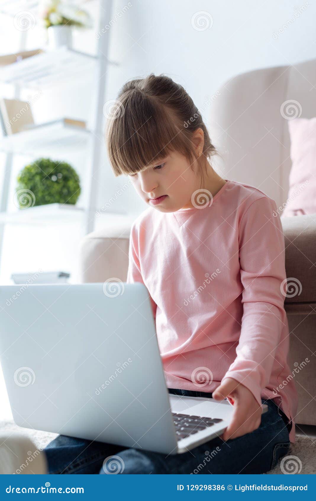 Kid with down syndrome stock photo. Image of daylight 129298386