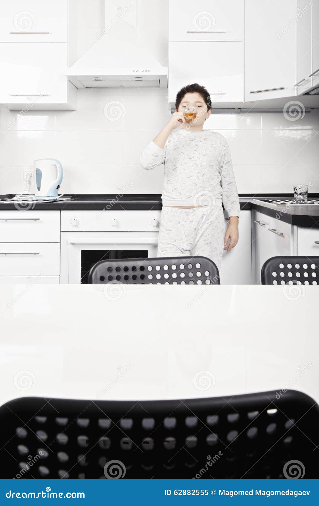 Kid drinking ice tea stock image. Image of glass, standing 62882555