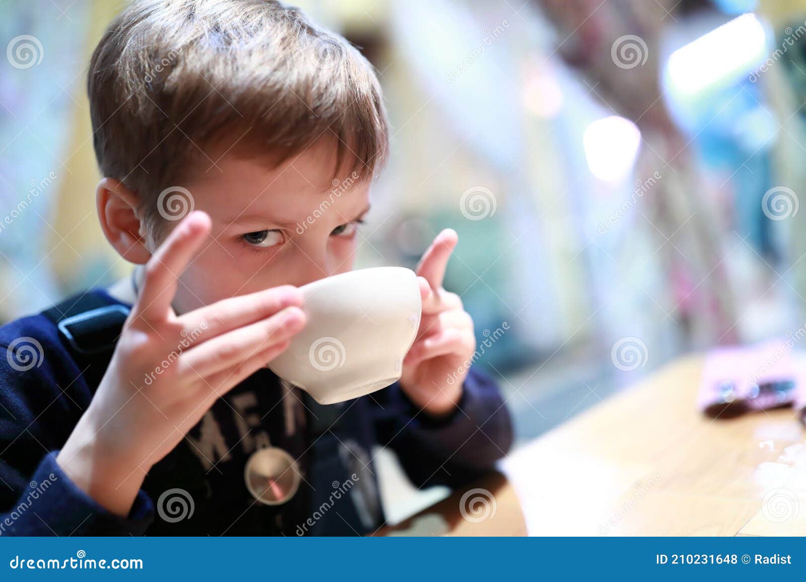 Kid Drinking Tea in Restaurant Stock Photo Image of liquid, hungry
