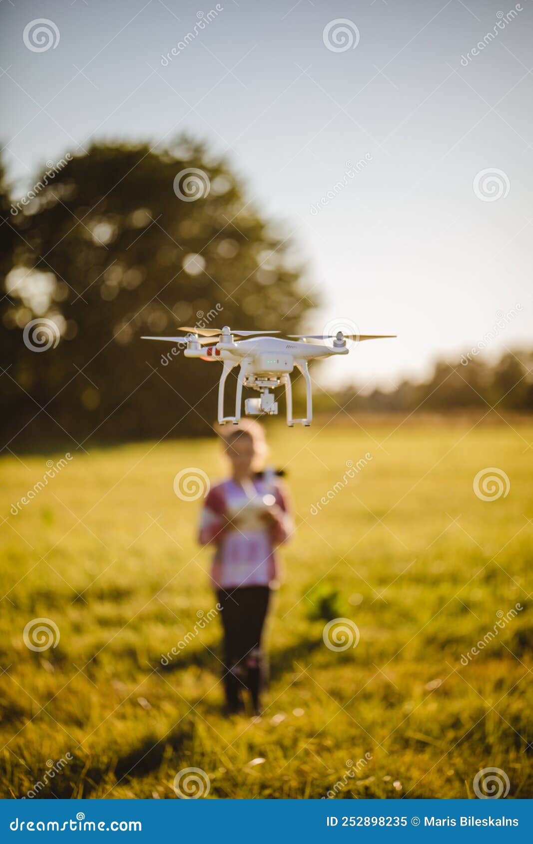 kid with dron in summer