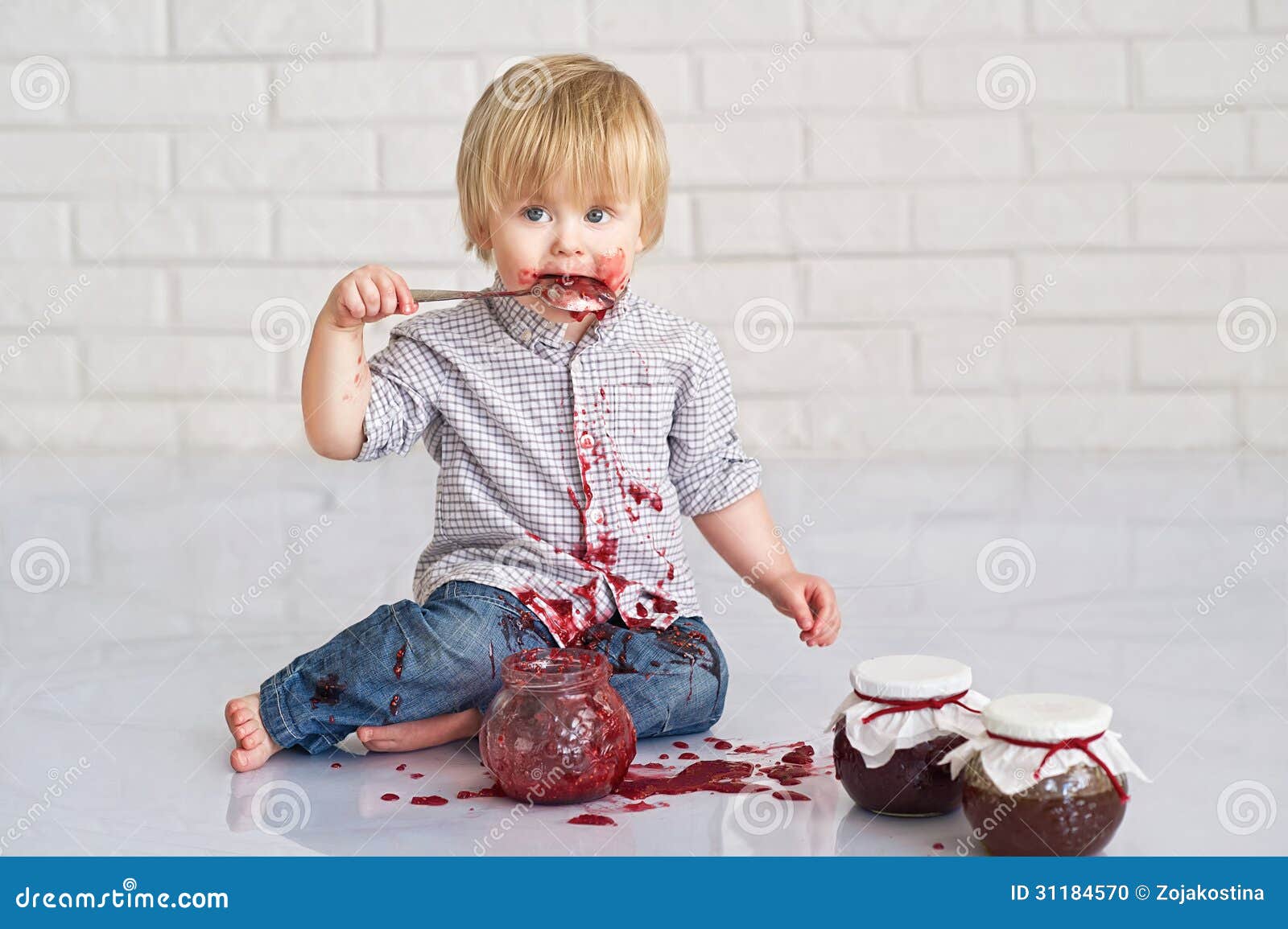 kid-eating-strawberry-jam-cute-little-boy-got-messy-glass-jars-31184570.jpg
