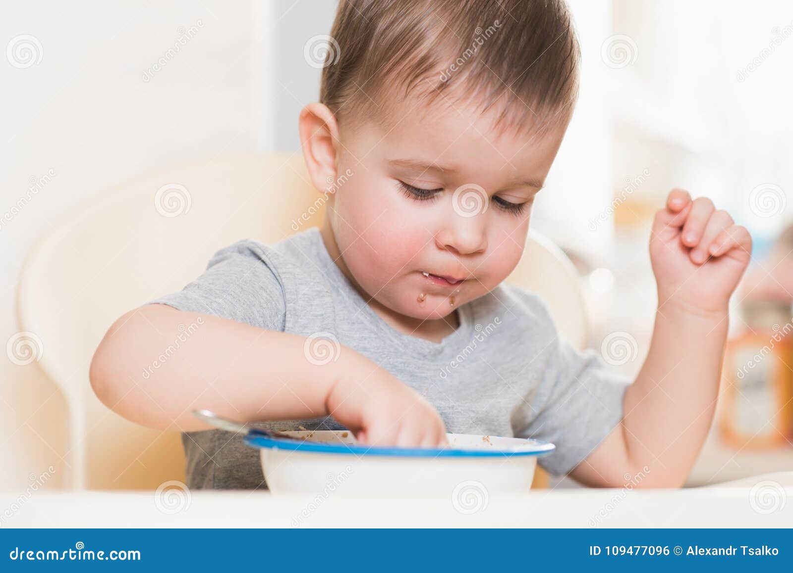 The Kid Eats Buckwheat Porridge in the Kitchen Stock Photo Image of