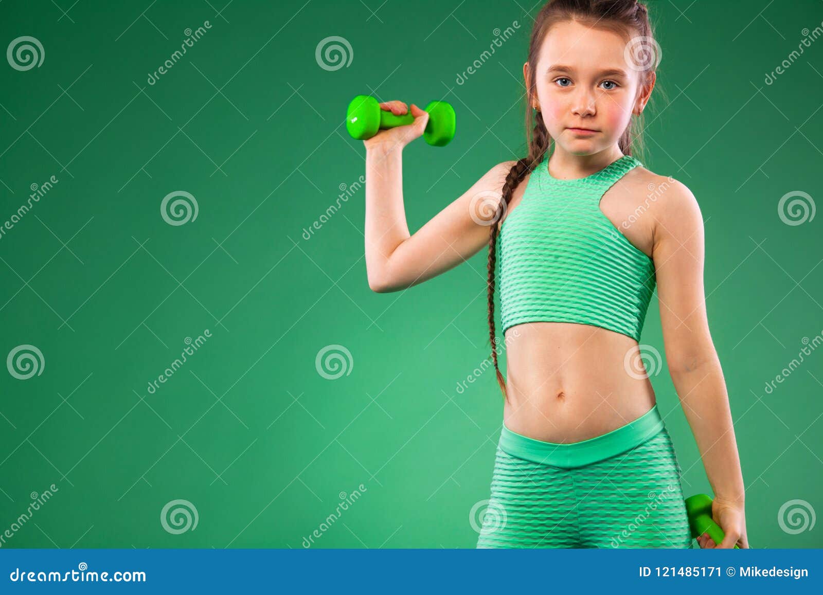 Kid Girl Doing Fitness Exercises on Green Background Stock Image ...