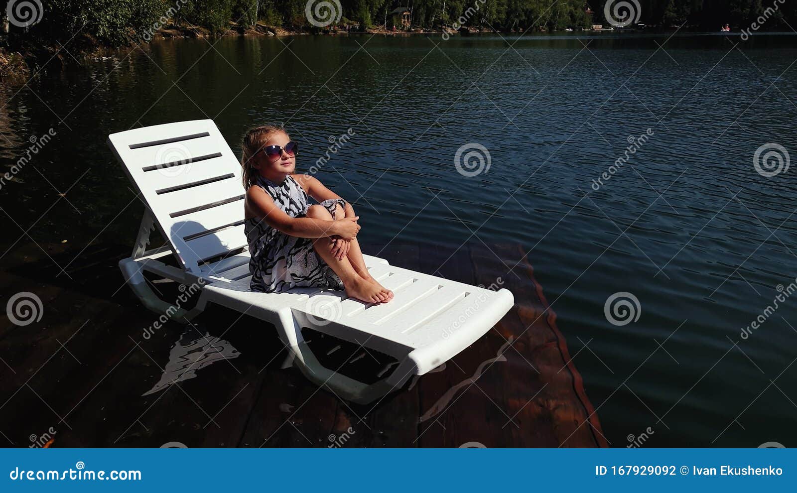 Kid Girl Lie on a Sunbed in Sunglasses and a Boho Silk Shawl. Child ...