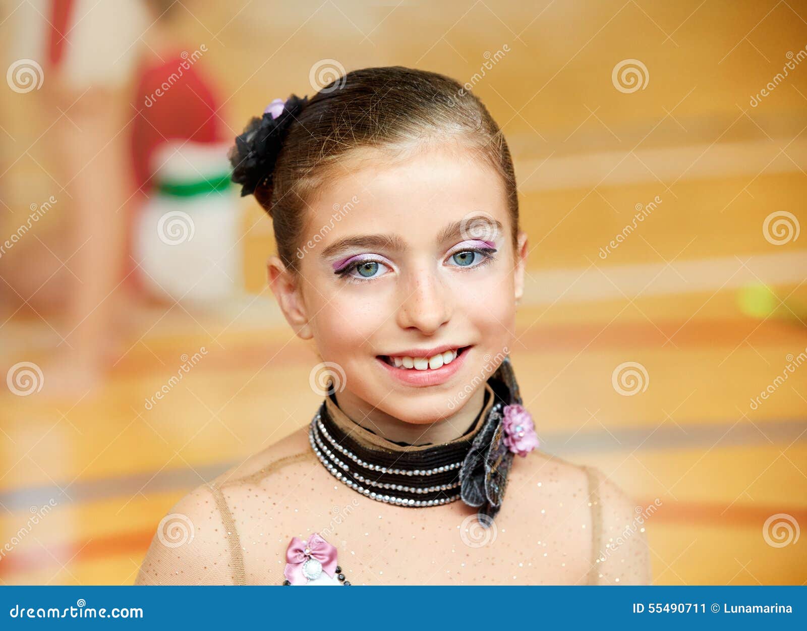 kid girl rhythmic gymnastics on wooden deck