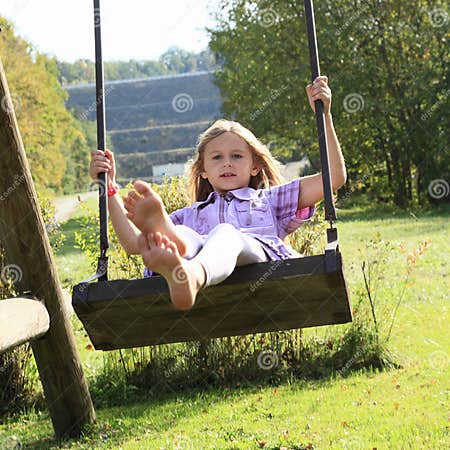 Kid - girl on swing stock image. Image of meadow, green - 45676439