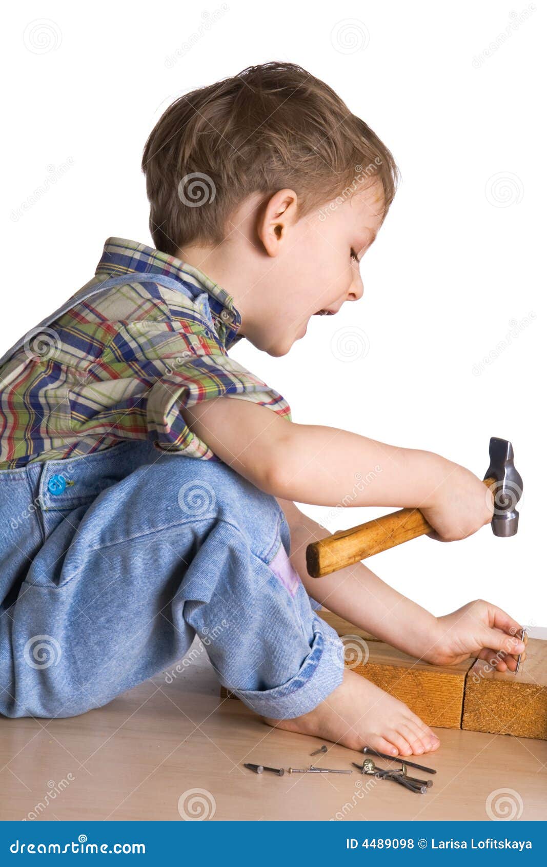 Kid Hammers A Hammer In Nails Picture. Image 4489098