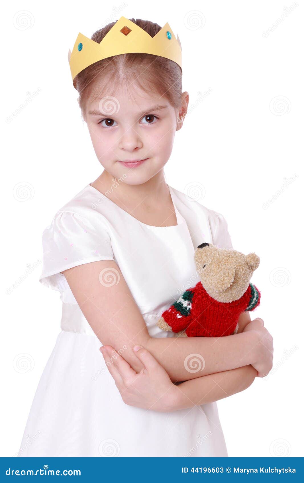kid holding teddy bear