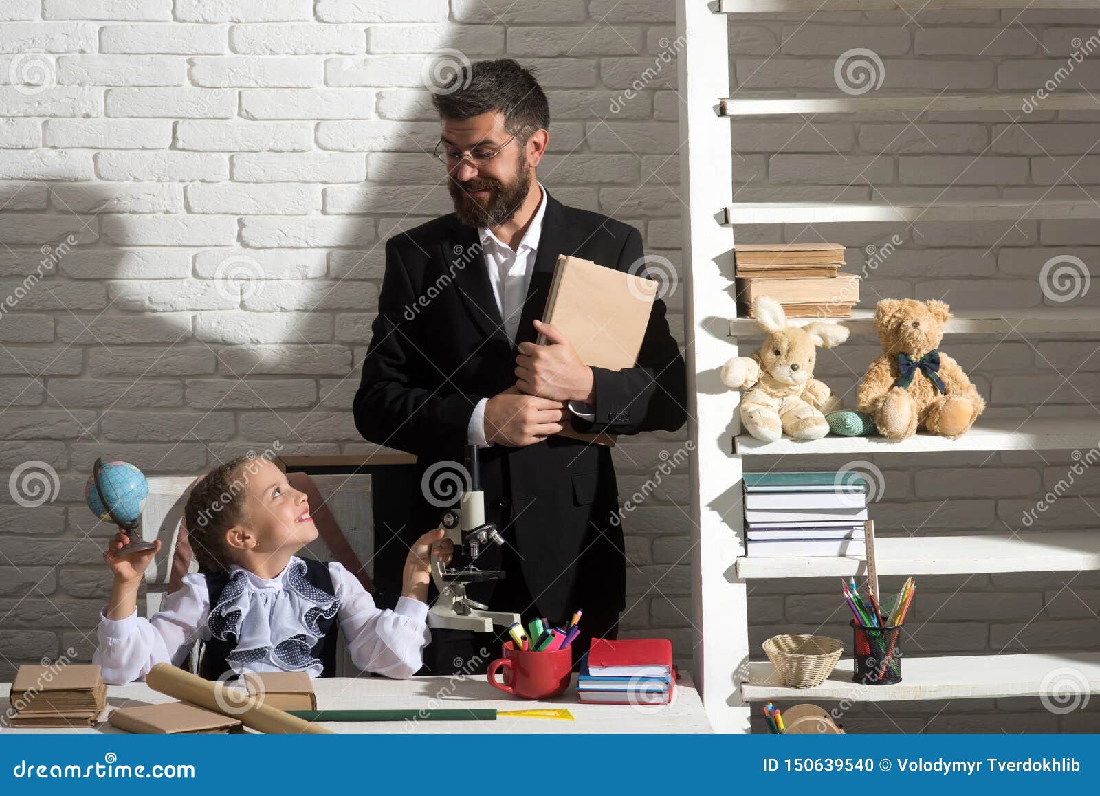 Kid And Man At Desk With School Items Stock Photo Image Of Braid