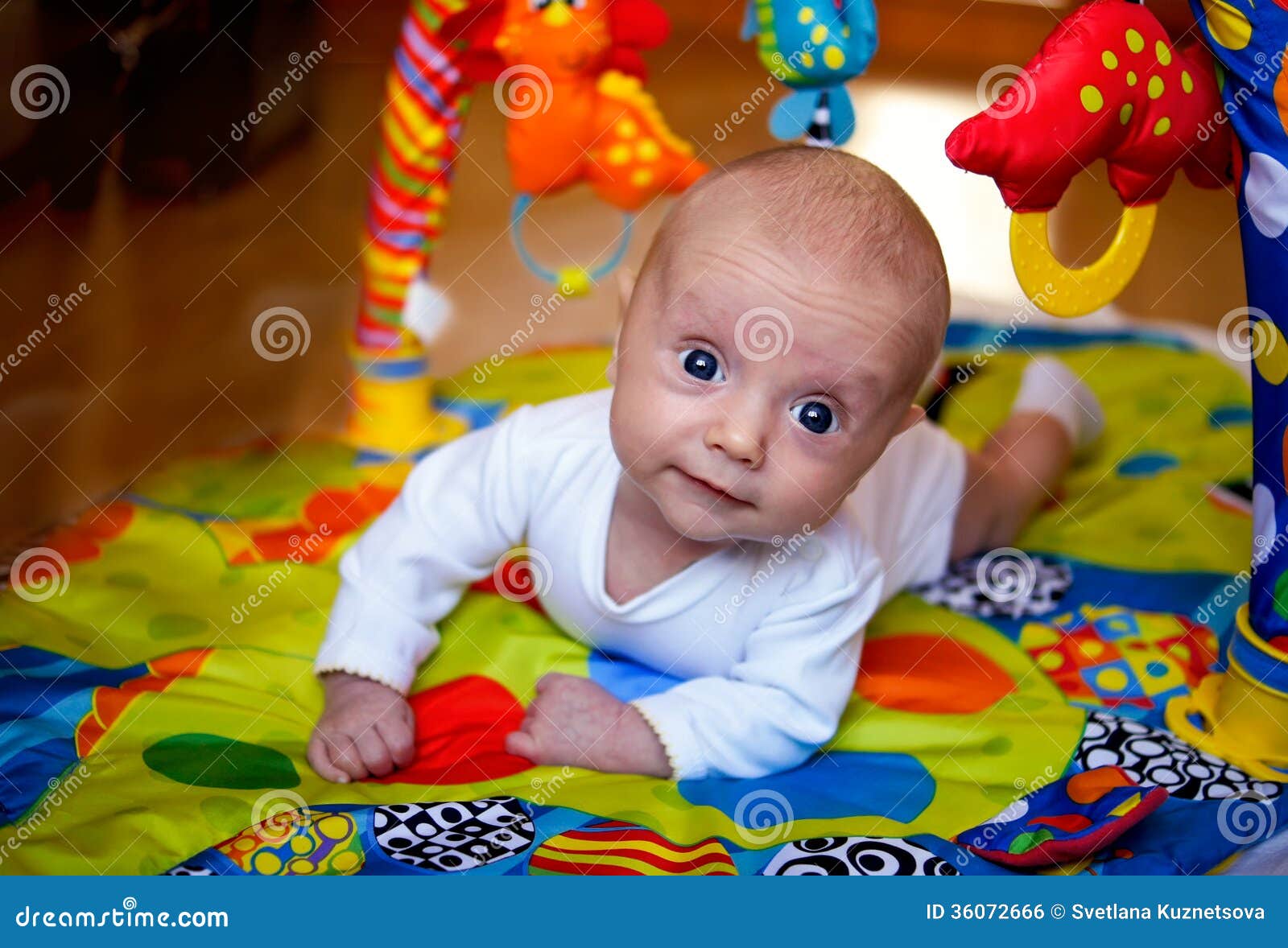 Kid on the play mat stock photo. Image of head, game 36072666