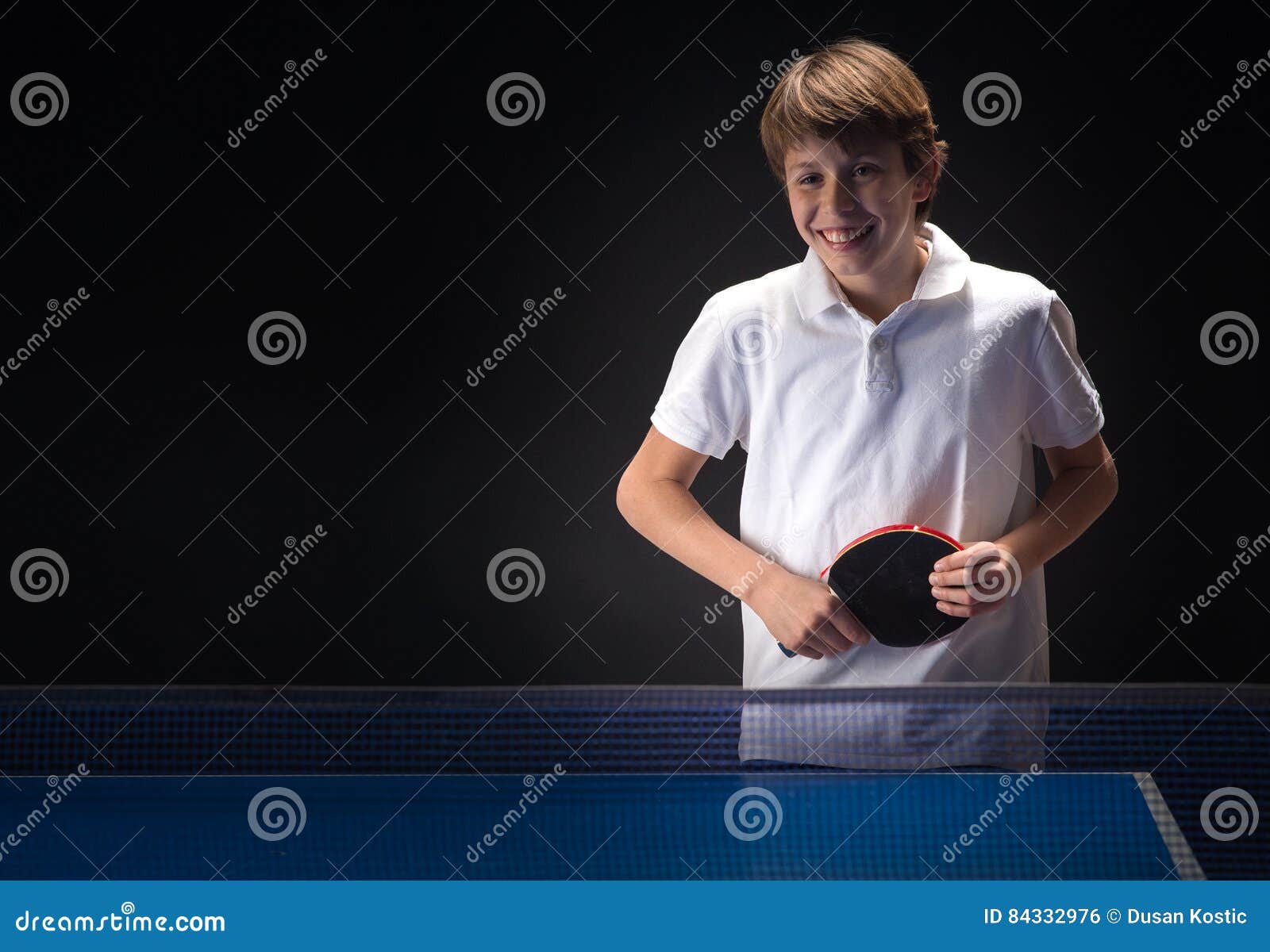 Kid playing table tennis stock photo. Image of indoors 84332976