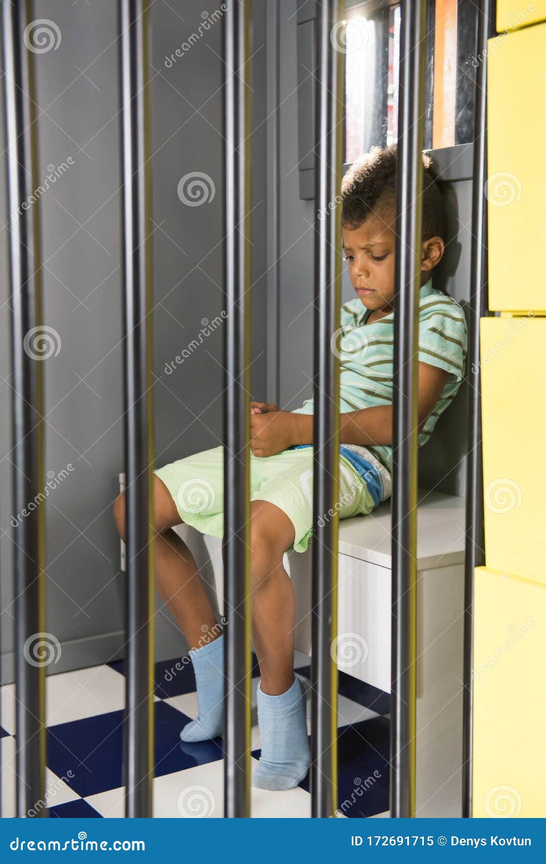 Kid Prisoner Try To Escape from Jail. Stock Image - Image of