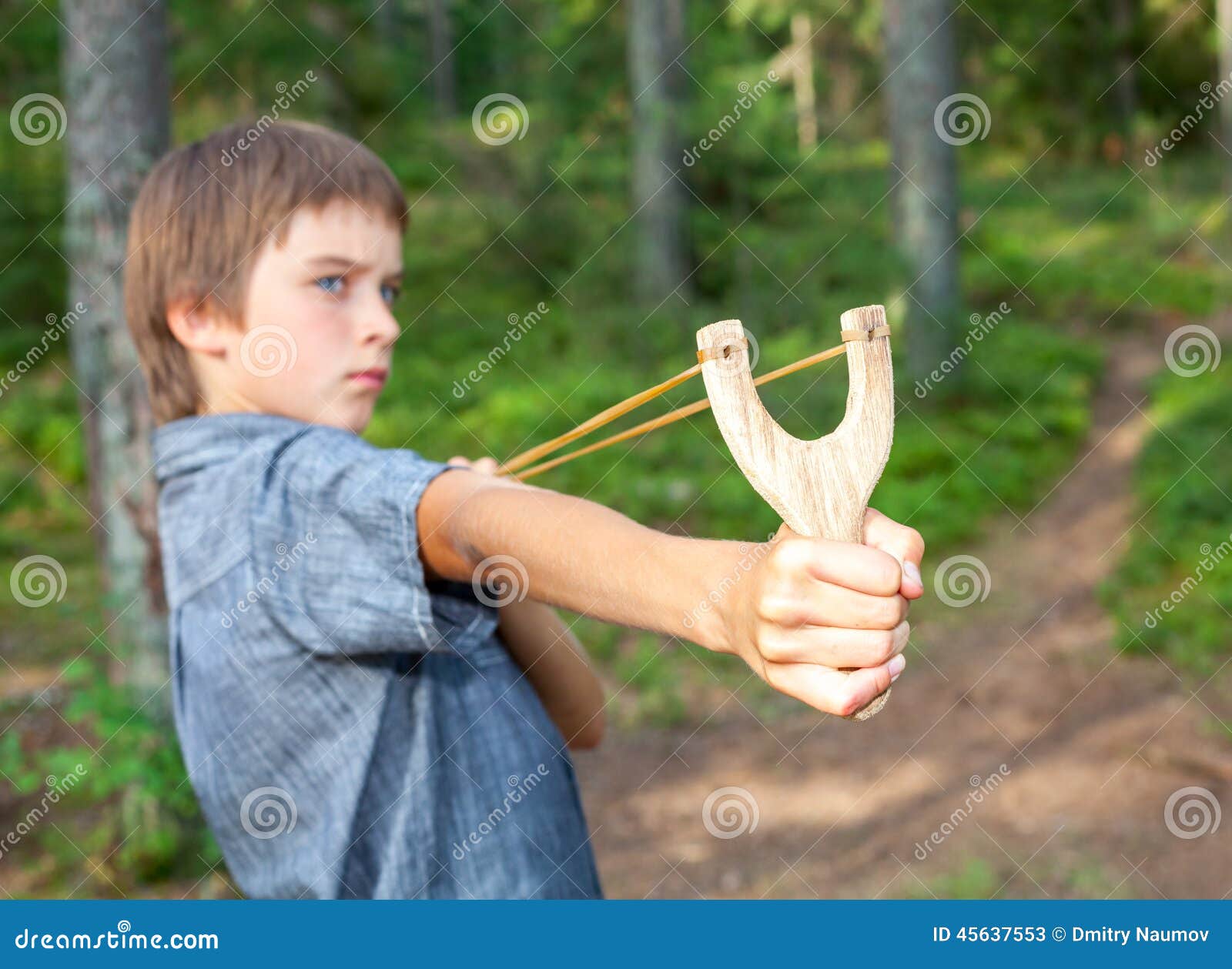 Kid with slingshot stock image. Image of danger, mischief 45637553