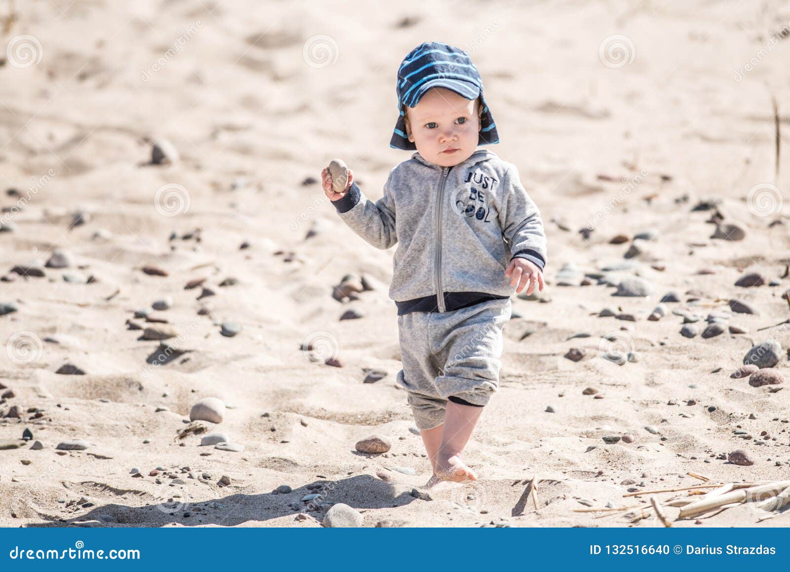 Kid walking on sand stock photo. Image of child, cute 132516640